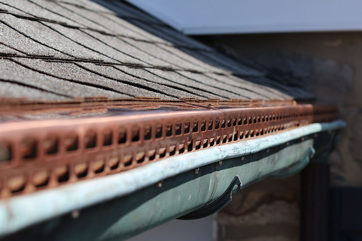 a close up of copper colored gutters 